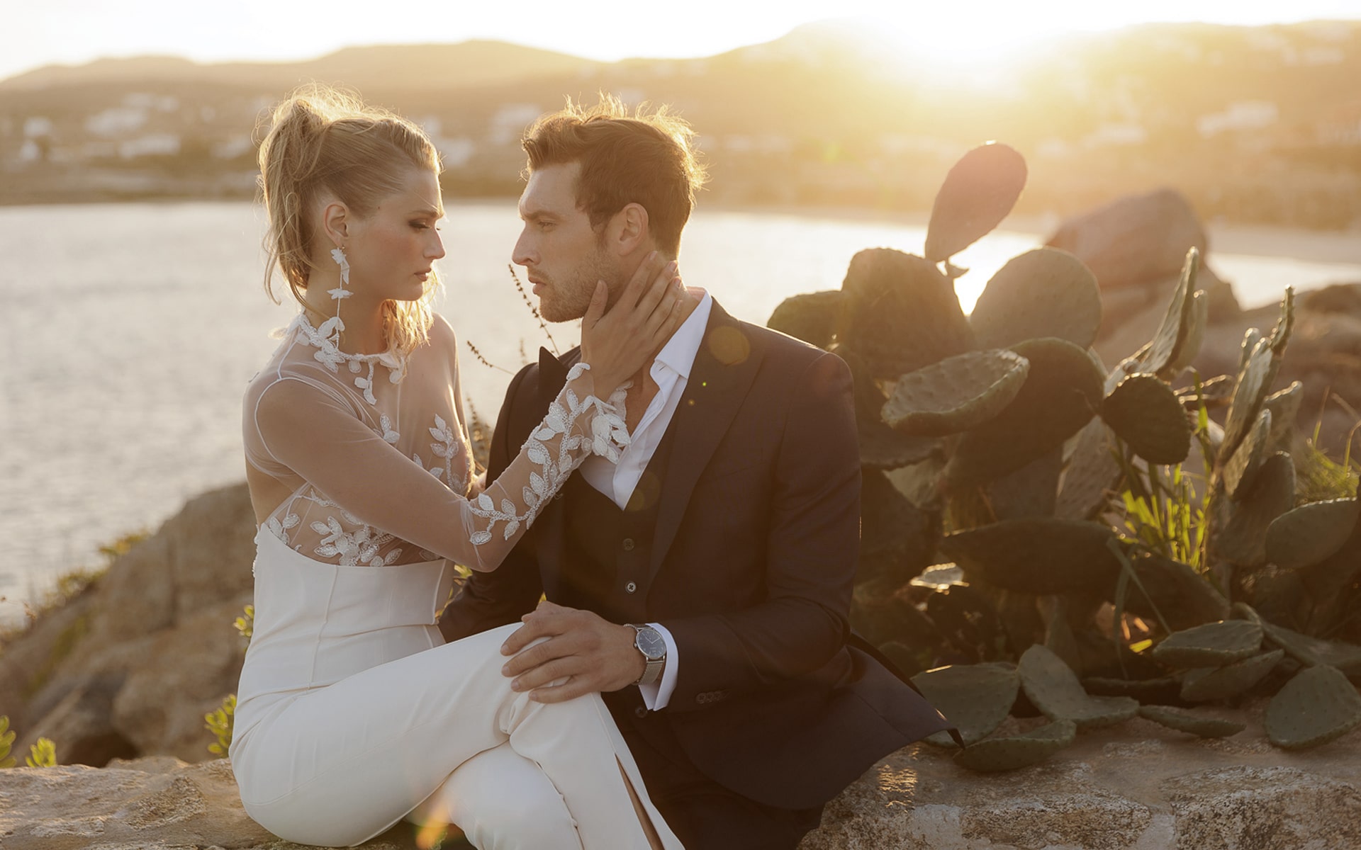 Cali weddings - couple in love with Mykonos at sunset as a backdrop