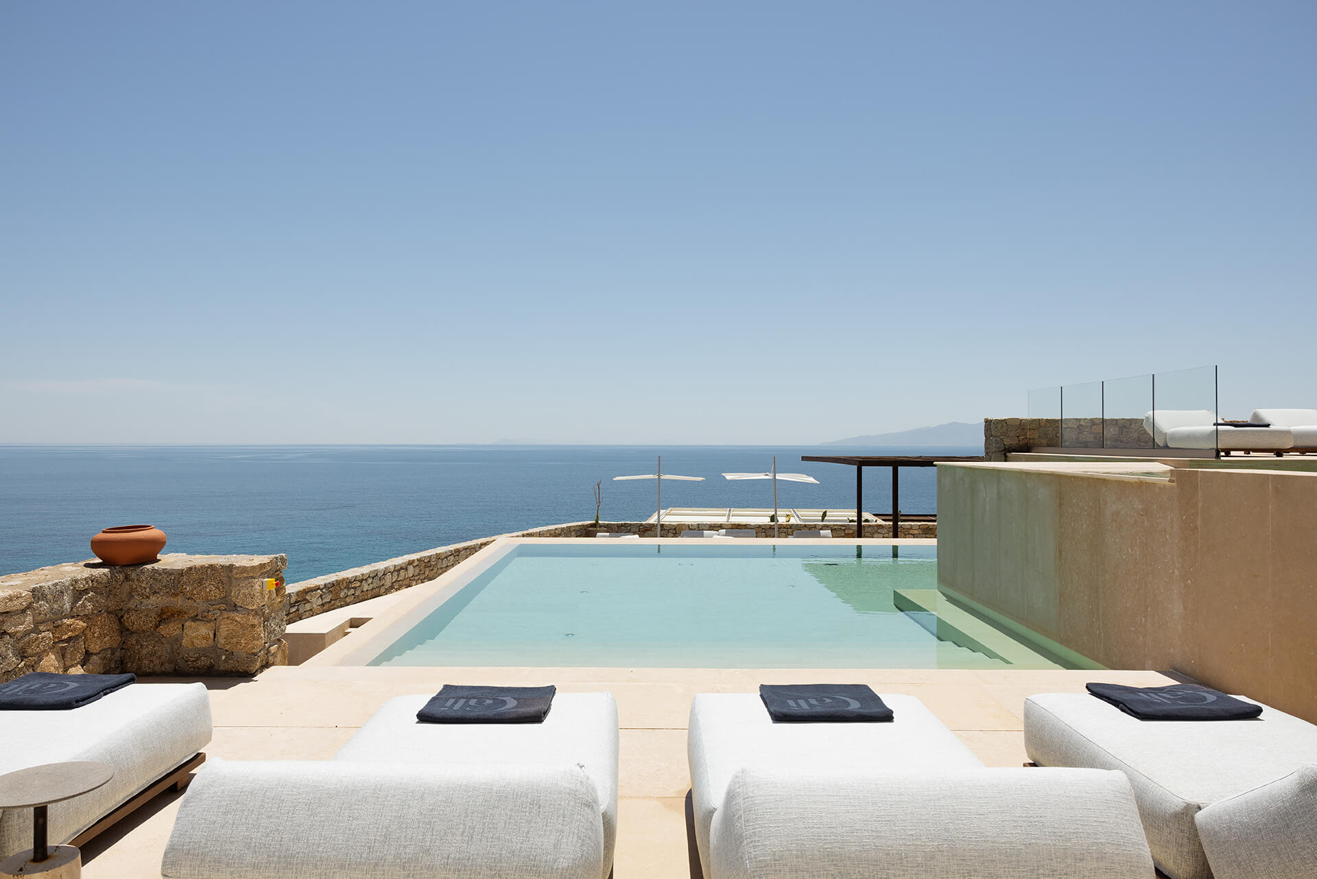 Villa Calliope 2nd Terrace with Pool: A stunning shot of the villa's terrace, featuring a pool overlooking the azure waters of the Aegean Sea.