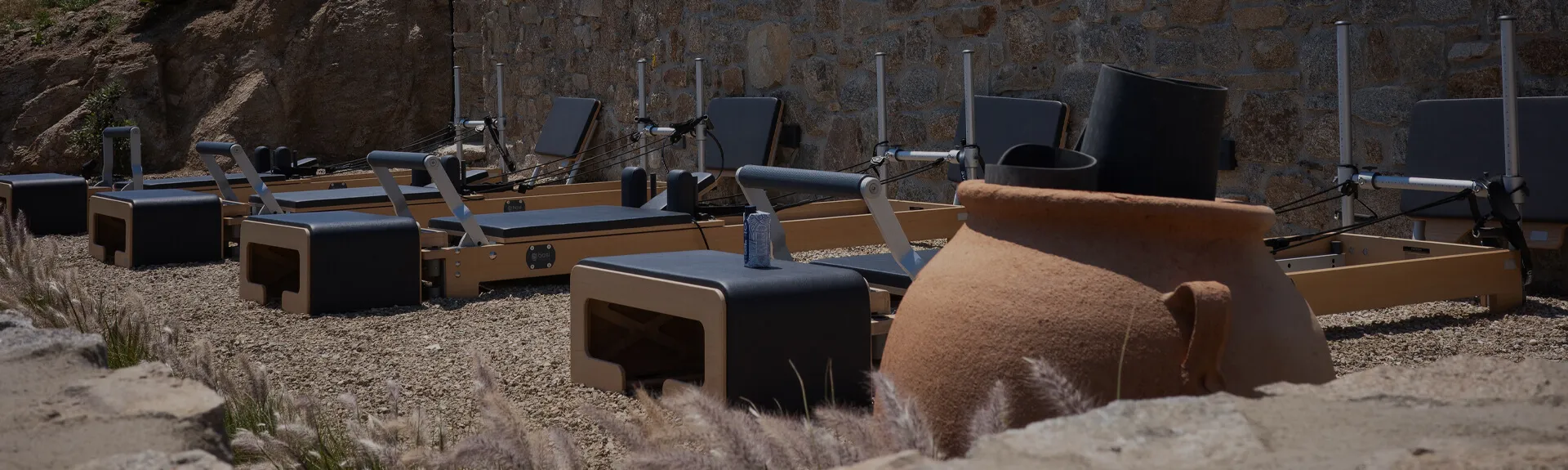 Serene wellness experience at Cali Mykonos, featuring outdoor Yoga and Pilates Reformer, Terra Fitness Club with top-tier equipment, and daily group classes for holistic relaxation.